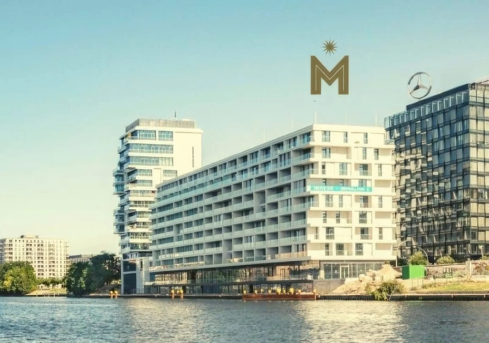Riverside building at East Side Gallery in Berlin with the MINA logo