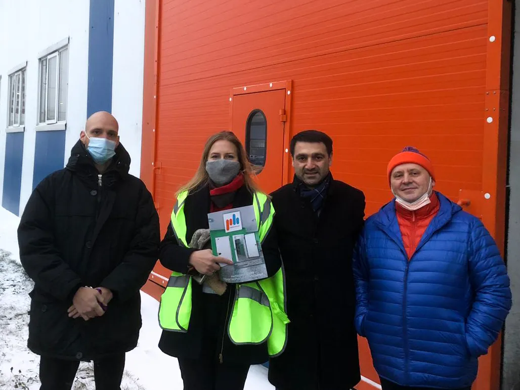 Bridge-One-Seven and PH Insulation team in front of the sandwich-panel building