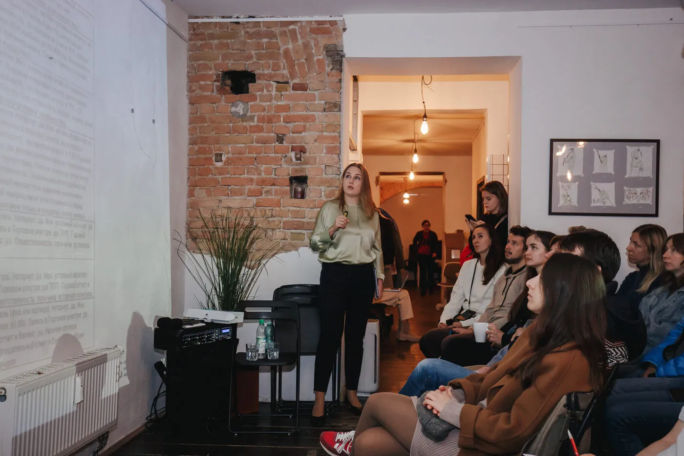 Speaker presenting to an audience in a small venue