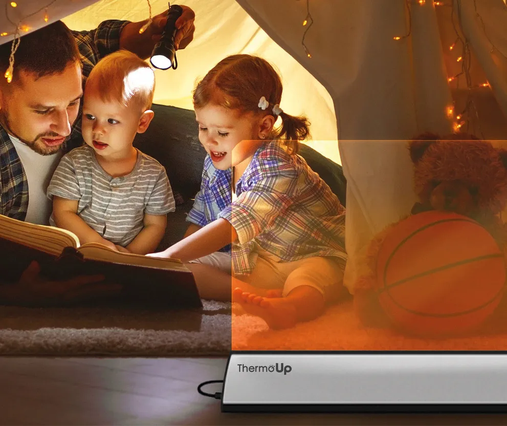 Family reading next to a ThermoUp heater